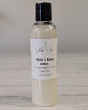 Hand and body lotion bottle with a label on a wooden surface