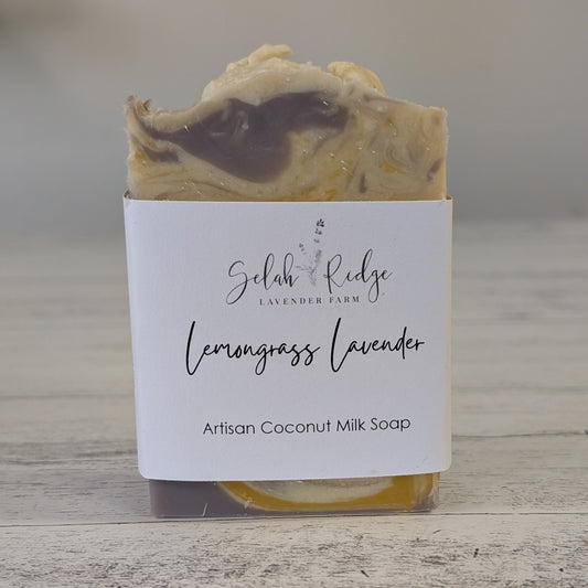 Artisan coconut milk soap with a label on a wooden surface